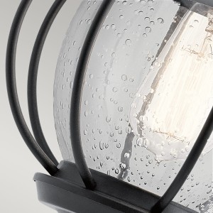 Kinkiet zewnętrzny Elstead Lighting Vandalia KL-VANDALIA2-S IP44 1xE27 Stal Czarny - zbliżenie włączonej żarówki za szklanym kloszem.