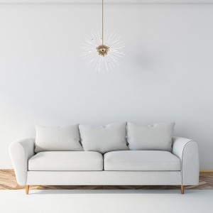 Lampa wisząca Zuma Line URCHIN Zuma Line 9xG9 42W Złoty Metal nad białą sofą w nowoczesnym wnętrzu.