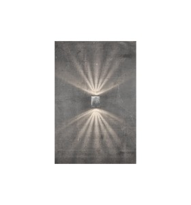 Lampa Ścienna Nordlux LED Metal Srebrny zamontowana na betonowej ścianie emitująca światło w górę i w dół.