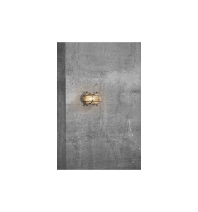 Lampa Ścienna Nordlux E27 12,5W Mosiądz Nikiel na betonowej ścianie.