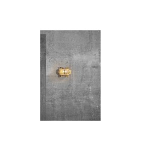 Lampa Ścienna Nordlux E27 12,5W Mosiądz na tle betonowej ściany.