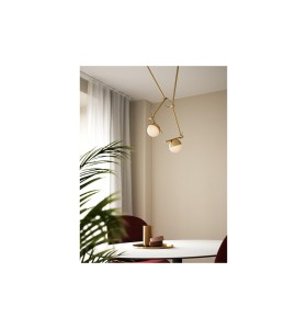 Lampa ścienna Kinkiet Nordlux G9 5W Metal Mosiądz nad nowoczesnym stołem.