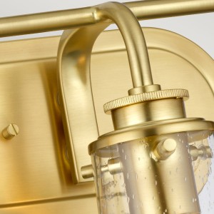 Lampa ścienna kinkiet Braelyn Elstead Lighting ze szkłem z bąbelkami powietrza w kolorze szczotkowanego mosiądzu.