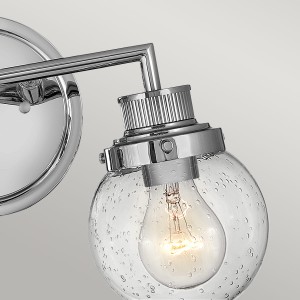 Lampa ścienna kinkiet Poppy Elstead Lighting polerowany chrom dziecińce szklanym kloszem z bąbelkami powietrza.