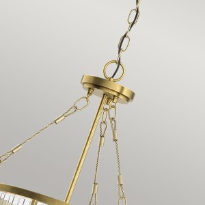 Lampa wisząca Roux Elstead Lighting z żebrowanym szkłem i elementami z naturalnego mosiądzu.