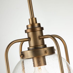 Lampa wisząca Triocent Elstead Lighting z naturalnego mosiądzu i szklaną kopułą z bąbelkami powietrza.