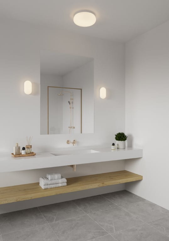 Biała lampa ścienna FOAM Nordlux w nowoczesnej łazience.