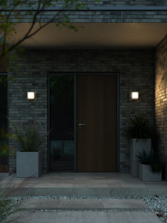 Lampa ścienna OLIVER Nordlux LED przy drzwiach wejściowych.