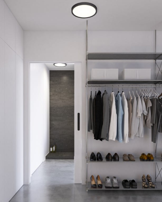 Lampa sufitowa LivaSmart Nordlux 1xLED Czarna w nowoczesnym wnętrzu szafy.